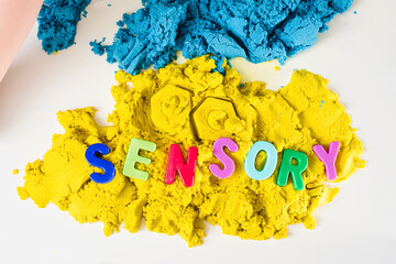 Sensory word and magic kinetic sand. Early sensory education. Kidd's sensory experiences, games and play for fine motor skills. Therapy hand, development of fine motor, autism, occupational therapy