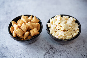 Dried wheat stars and pads for breakfast in a bowl