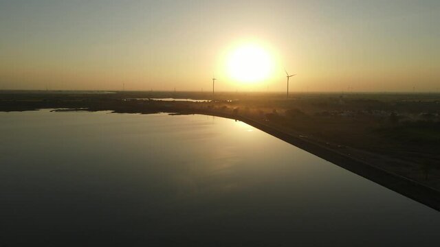 dam water aerial view taken from 300 meters above the surface. Amazing Aerial sunset view of Dam. 4k resolution.