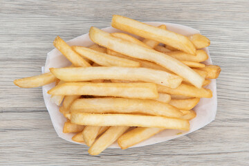 Overhead view of side order of french fries are delicious to eat all by themself as well.