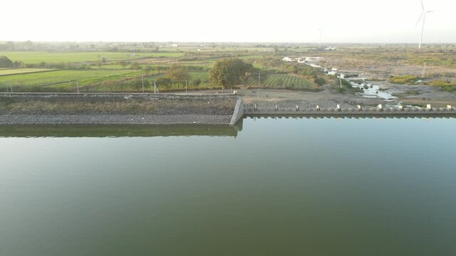 dam water aerial view taken from 300 meters above the surface. Amazing Aerial sunset view of Dam. 4k resolution.