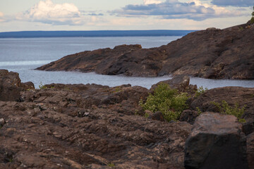 Coastline of Lake Superior with blue sky and white clouds, Michigan, USA