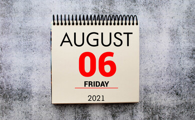 Save the Date written on a calendar - August 06