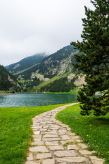 Beautiful stone path leading to the lake in Vall de Nuria valley Sanctuary in the Catalan Pyrenees, Spain,Europe