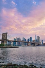 Fototapeta na wymiar Panoramic view of Brooklyn bridge and Manhattan skyline in NYC