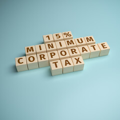 Wooden toy blocks forming the words "15% minimum corporate tax". Initiative to implement a global minimum tax for large companies.