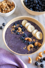 Healthy breakfast. Smoothie bowl with blueberries, nuts and banana. Keto diet.
