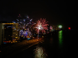 Fireworks at night with city