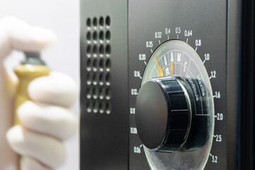 Dentist taking a radiography after graduate the radiation intensity