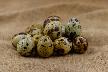 Quail eggs on a sackcloth background