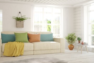 White living room with sofa and summer landscape in window. Scandinavian interior design. 3D illustration