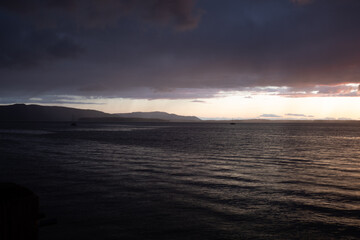 Fototapeta premium Sunset at Bellingham Bay, Washington. Cornwall Beach Park. Blue hour ocean view.