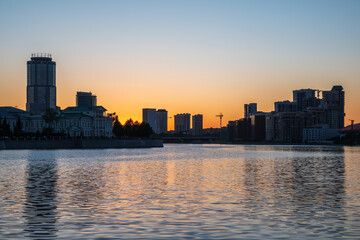 Fototapeta premium Sunset on a pond in the center of the city. Yekaterinburg, Russia