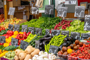 Market stall with different kinds of fresh vegetables for sale