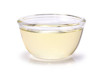 Oil in glass bowl isolated on white background. Clipping path.