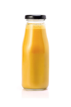 Yellow orange smoothie juice in glass bottle isolated on white background.