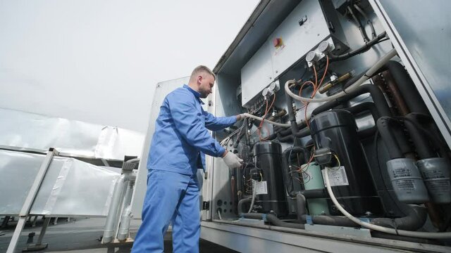 The technician repair electronic temperature sensors with an electronic soldering iron - Powered by Adobe