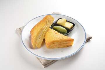 baked layer French cheese egg toast with kaya jam and butter with half boiled egg in bowl western mixed asian halal menu