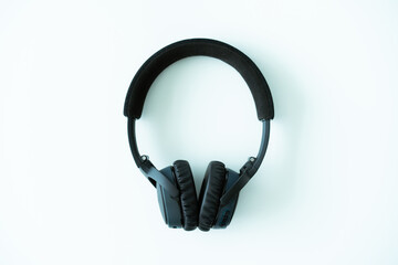 Fototapeta premium Modern wireless on ear headphones on white table close up. Professional stereo wireless headphone.