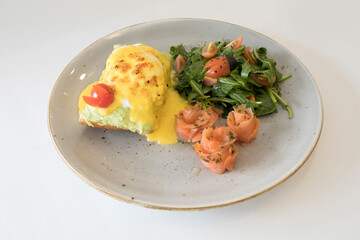 western luxury breakfast with avocado toast, boiled egg, smoked salmon fish, fried potato cake and salad halal breakfast menu 
