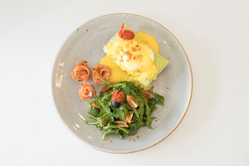 western luxury breakfast with avocado toast, boiled egg, smoked salmon fish, fried potato cake and salad halal breakfast menu 