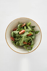 fresh green vegetable salad with cherry tomato in bowl vegan halal menu
