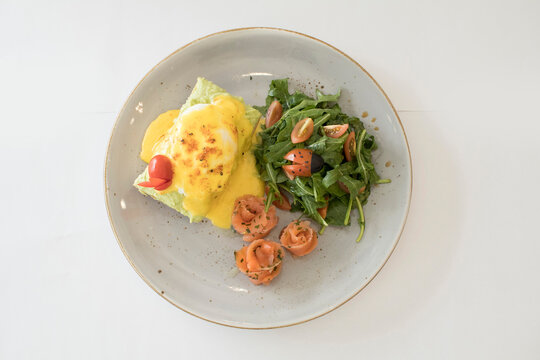 western luxury breakfast with avocado toast, boiled egg, smoked salmon fish, fried potato cake and salad halal breakfast menu 