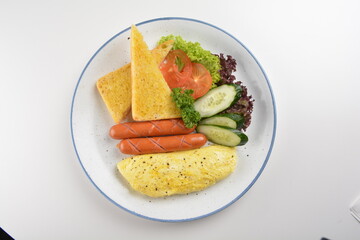 western big breakfast with butter toast, fried scramble egg, sausage, grill bacon, ham, omelette, bean and salad halal breakfast menu 
