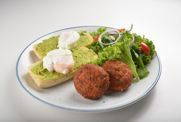 western luxury breakfast with avocado toast, boiled egg, smoked salmon fish, fried potato cake and salad halal breakfast menu 