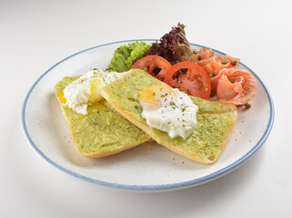 western luxury breakfast with avocado toast, boiled egg, smoked salmon fish, fried potato cake and salad halal breakfast menu 