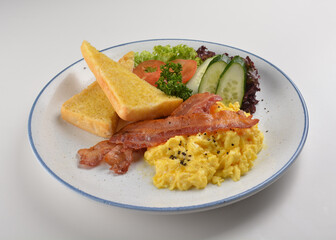 western big breakfast with butter toast, fried scramble egg, sausage, grill bacon, ham, omelette, bean and salad halal breakfast menu 