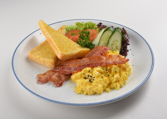 western big breakfast with butter toast, fried scramble egg, sausage, grill bacon, ham, omelette, bean and salad halal breakfast menu 