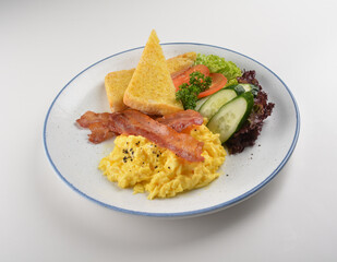 western big breakfast with butter toast, fried scramble egg, sausage, grill bacon, ham, omelette, bean and salad halal breakfast menu 