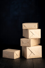 parcels or gifts wrapped in wrapping paper on black background