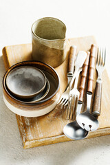 Modern ceramic tableware and old utensils.