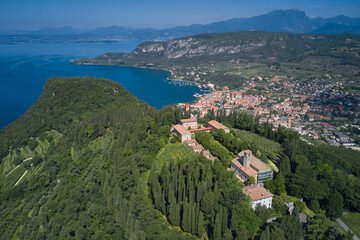 Aerial panorama Monastery on the hill. Home of Italian monks, lake garda. Monastery on the Eremo di...