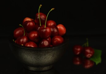 Sweet cherries on black background, low key cherries, 