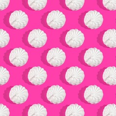 Pattern with white marshmallows on pink background. Top view, flat lay