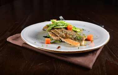 pan fried fresh grouper fish fillet seafood with asparagus and sauce main course in dark background western halal menu