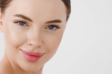 Obraz premium Beautiful woman face healthy skin natural make up lips close up blue eyes
