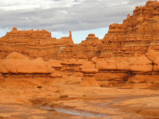    fantastically eroded red  rock hoodoos in  goblin valley state park, utah,  at dusk    