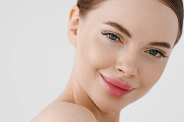 Obraz premium Beautiful woman face healthy skin natural make up lips close up blue eyes
