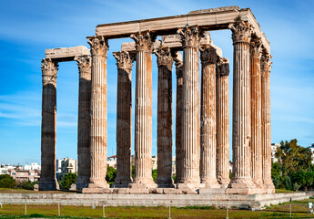 View of the Temple of Olympian Zeus aka the Olympieion or Columns of the Olympian Zeus, a former colossal temple at the center of Athens, Greece. - obrazy, fototapety, plakaty