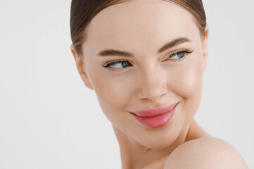 Obraz premium Beautiful woman face healthy skin natural make up lips close up blue eyes