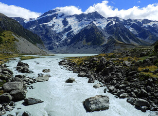 spectacular views of mount cook and the hooker river along the hooker valley track on a summer day in summer,  near mount cook village on the south island of new zealand