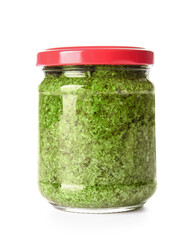 Jar with fresh pesto sauce on white background