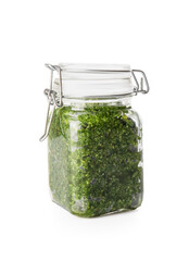 Jar with fresh pesto sauce on white background