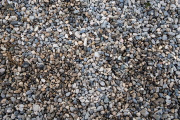 Little rocks, pebbles, texture of the road. Gray closeup natural elements for background,...