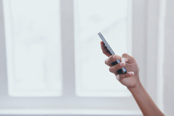 Hand holding smartphone device.