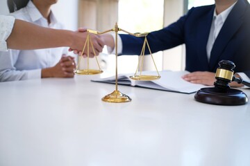  Female lawyer handshake with client. Business partnership meeting successful concept.